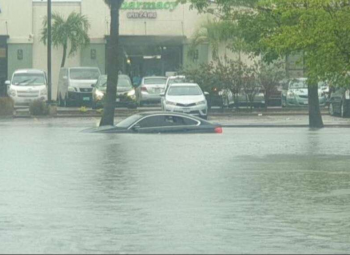 Local Government Minister Urges Caution as Trough Persists, Mourns Loss of Life in Flooding Incident